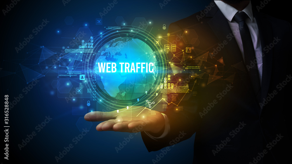 Elegant hand holding WEB TRAFFIC inscription, digital technology concept Elegant hand holding WEB TRAFFIC inscription, digital technology concept
