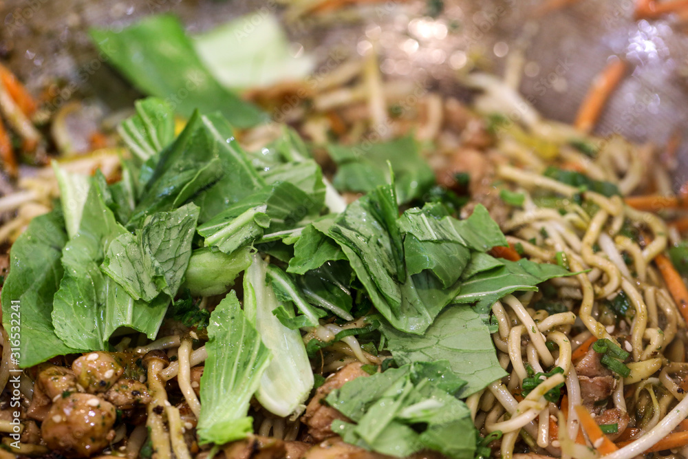 Fototapeta premium Chicken chow mein a popular oriental dish available at chinese restaurants