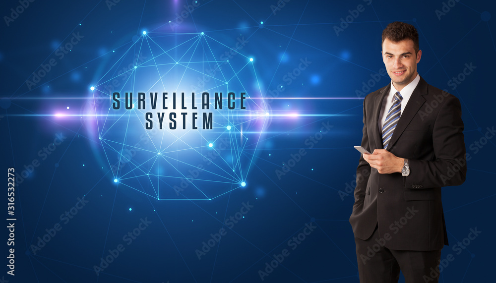 Businessman thinking about security solutions with SURVEILLANCE SYSTEM inscription Businessman thinking about security solutions with SURVEILLANCE SYSTEM inscription
