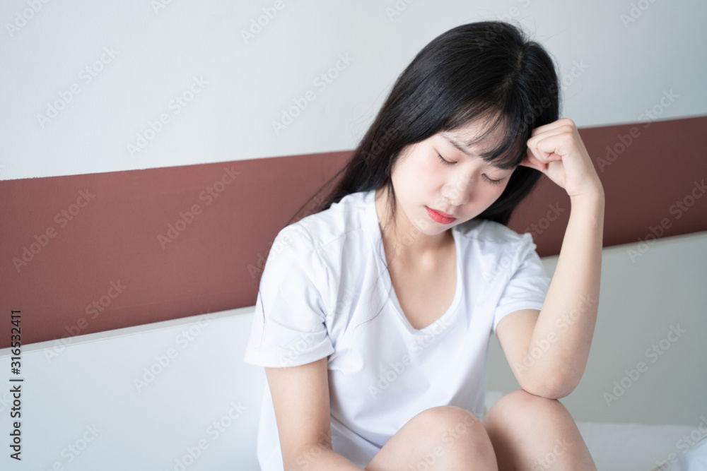 Single beautiful asian woman sad and lonely on bed Single beautiful asian woman sad and lonely on bed