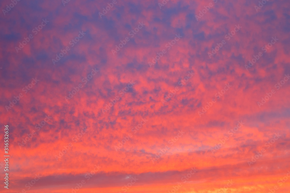 Sunset sky red clouds background