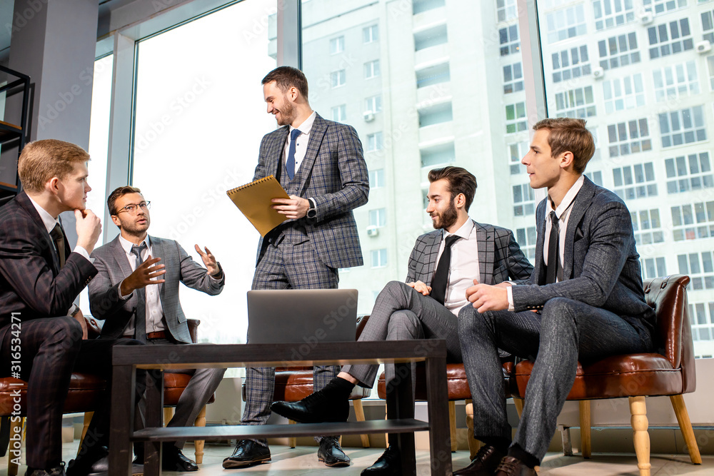 leadership and business concept. men in suits coworking together in modern office with big panoramic window, stylish elegant people discuss business ideas leadership and business concept. men in suits coworking together in modern office with big panoramic window, stylish elegant people discuss business ideas