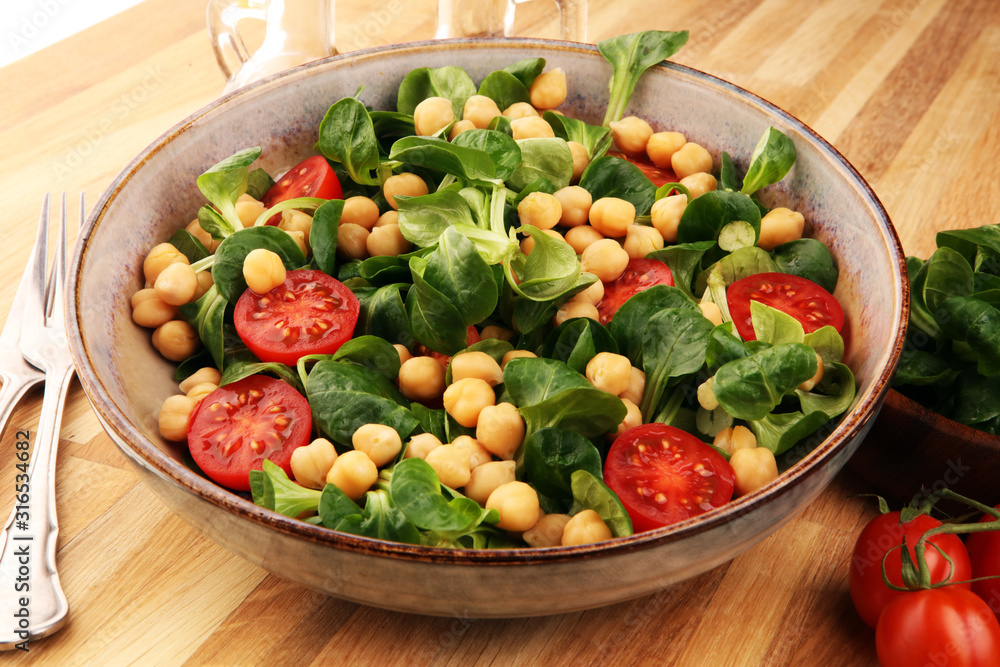 chickpea salad with ingredient and tomatoes and lamb´s lettuce. healthy salad chickpea salad with ingredient and tomatoes and lamb´s lettuce. healthy salad
