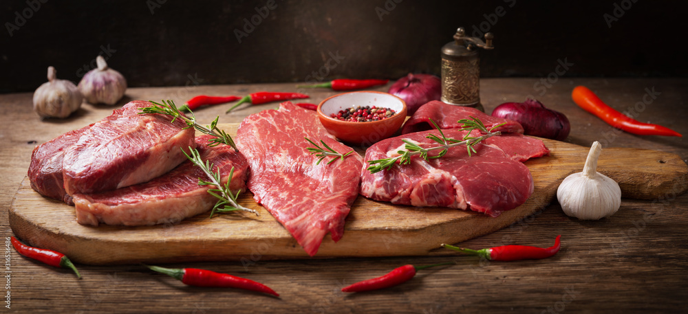 fresh meat with rosemary and spices - obrazy, fototapety, plakaty 