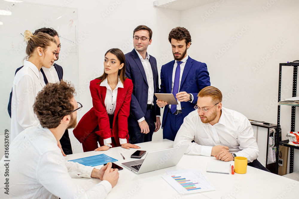 best workers of successful busness team gathered in office to discuss new business project, to plan their strategy fot future together best workers of successful busness team gathered in office to discuss new business project, to plan their strategy fot future together
