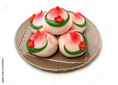 Traditional Chinese birthday bun named Shou Bao served on birthdays on white background
