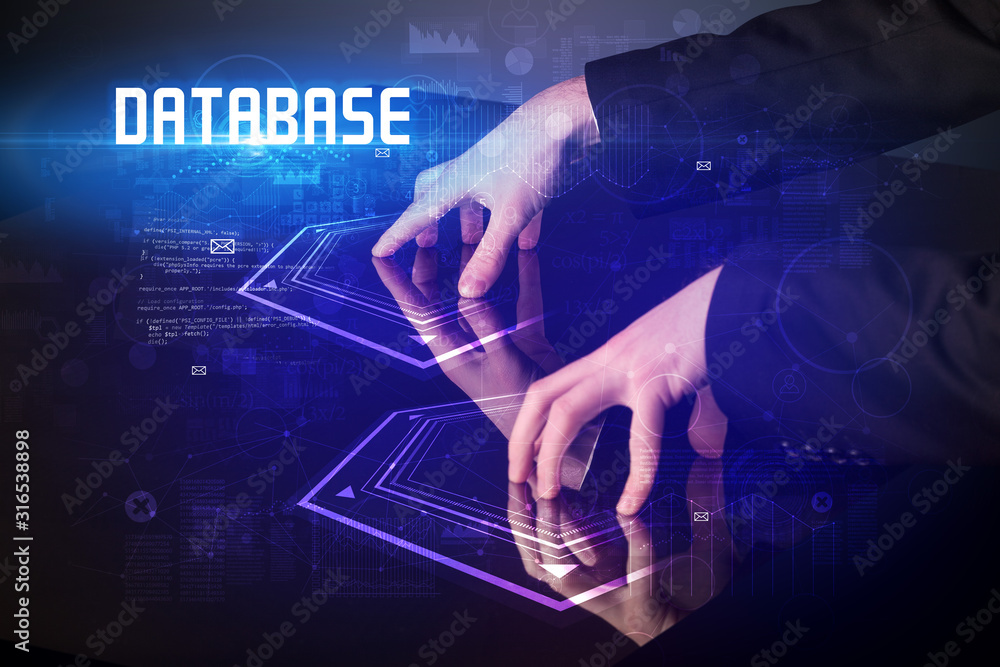 Hand touching digital table with DATABASE inscription, new age security concept Hand touching digital table with DATABASE inscription, new age security concept