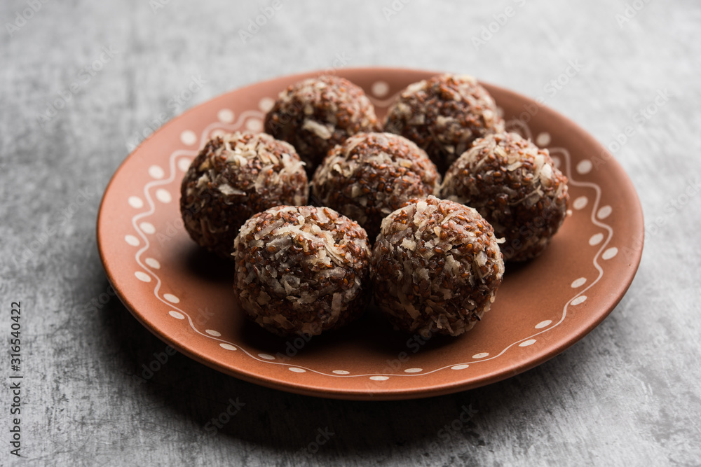 Aliv Laddu, Halim Ladoo or Garden cress Seed sweet Balls a very nutritious food in winters or for New Moms. popular food from India. served in a bowl or plate Aliv Laddu, Halim Ladoo or Garden cress Seed sweet Balls a very nutritious food in winters or for New Moms. popular food from India. served in a bowl or plate