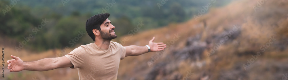 Bearded man breathing fresh air and open arms. Bearded man breathing fresh air and open arms.