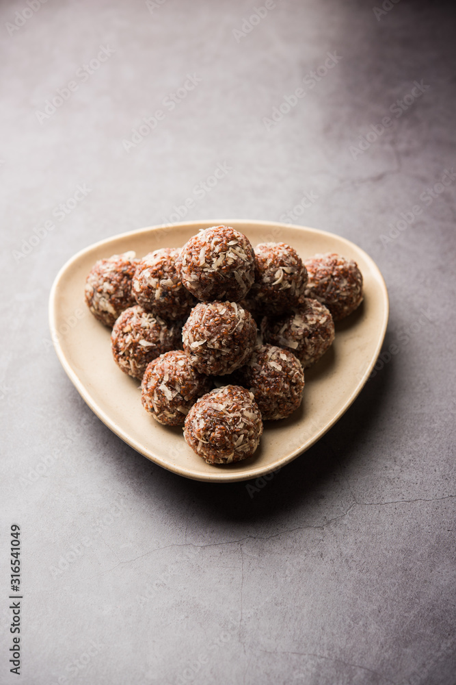 Aliv Laddu, Halim Ladoo or Garden cress Seed sweet Balls a very nutritious food in winters or for New Moms. popular food from India. served in a bowl or plate Aliv Laddu, Halim Ladoo or Garden cress Seed sweet Balls a very nutritious food in winters or for New Moms. popular food from India. served in a bowl or plate