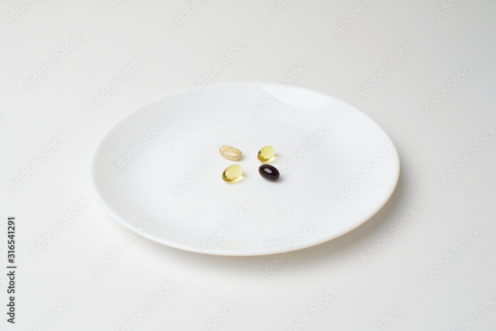 Multivitamin and mineral supplements. Plate with tablets. Meal replacement. Multivitamin and mineral supplements. Plate with tablets. Meal replacement.