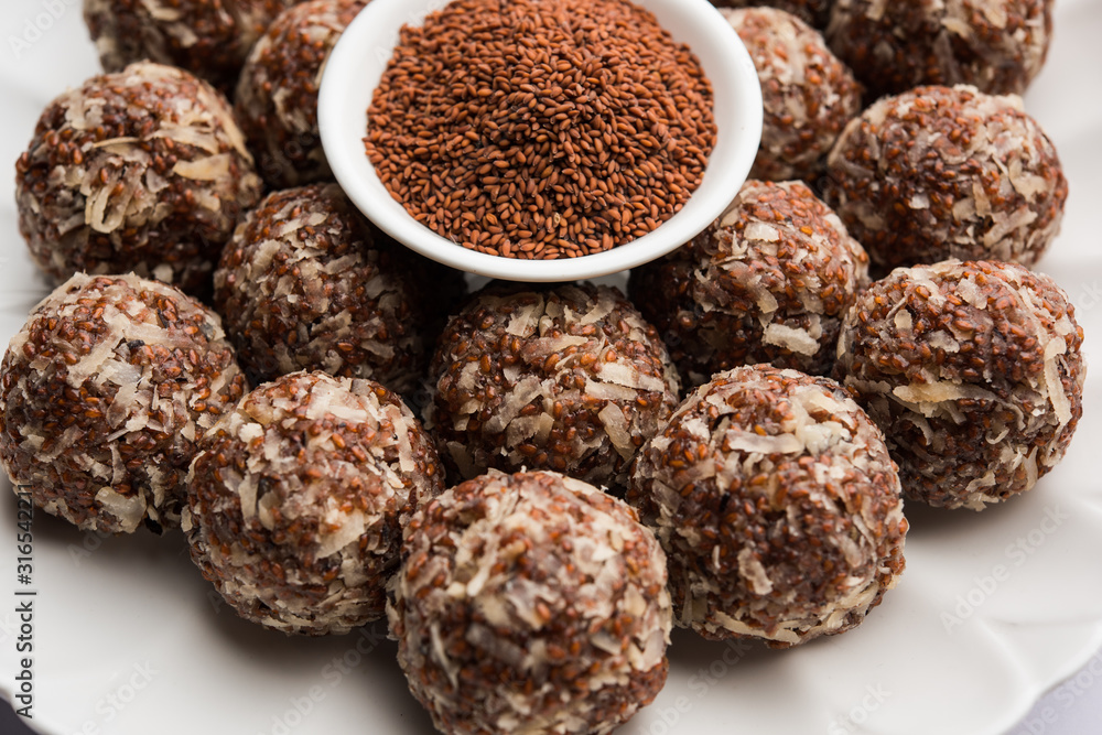 Aliv Laddu, Halim Ladoo or Garden cress Seed sweet Balls a very nutritious food in winters or for New Moms. popular food from India. served in a bowl or plate Aliv Laddu, Halim Ladoo or Garden cress Seed sweet Balls a very nutritious food in winters or for New Moms. popular food from India. served in a bowl or plate