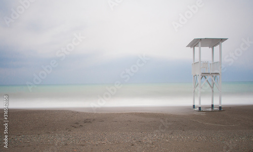 white watch post in the beach © urdialex