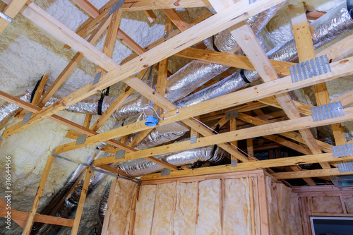 Air conditioning system attached to attic ceiling, foam plastic Insulation of a new home