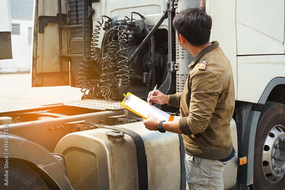 Truck Driver is Checking the Semi Truck's Maintenance Checklist ...