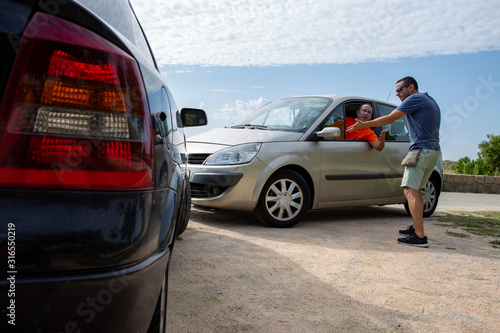 two men having a discussion about a car accident