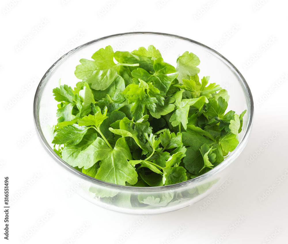 Fresh parsley leaves in glass bowl isolated on white background with clipping path Fresh parsley leaves in glass bowl isolated on white background with clipping path