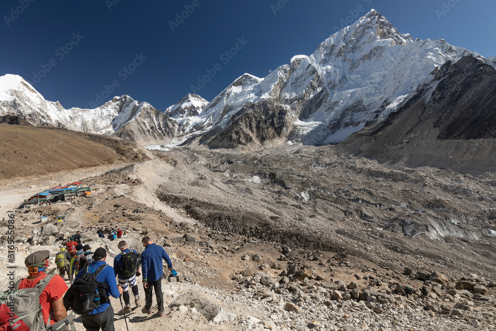 Trekker approaching Everest base Camp and Mt Everest