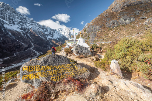 A trekker near a Stuppa heading to Everest Base Camp in Himalaya, Nepal