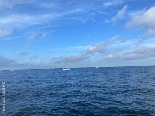 Sea, the sky and fishing boat.