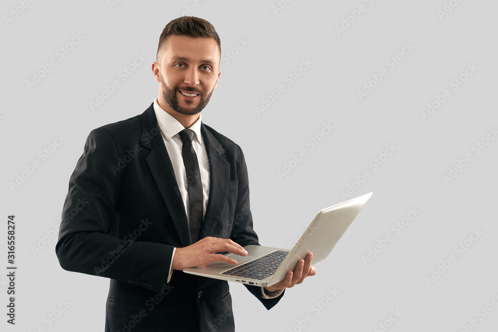 Portrait of businessman typing on laptop. Portrait of businessman typing on laptop.