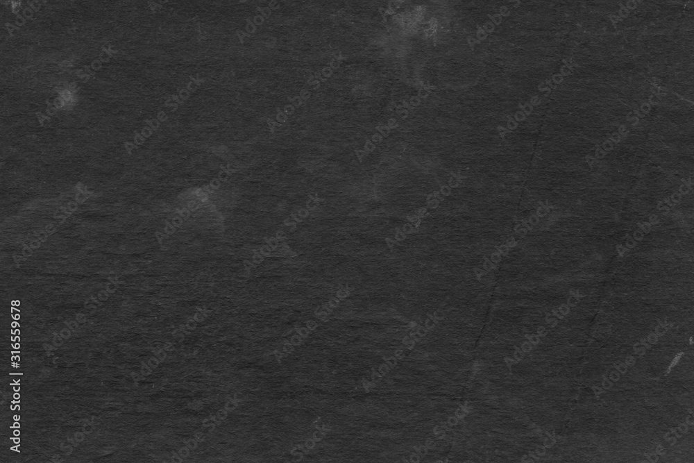 Cardboard black abstract texture close-up. Dark old paper background. Grunge concrete wall. Vintage blank wallpaper. Cardboard black abstract texture close-up. Dark old paper background. Grunge concrete wall. Vintage blank wallpaper.