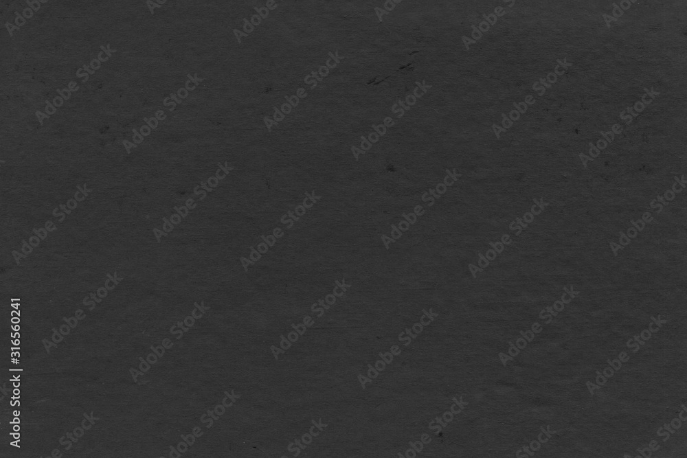 Cardboard black abstract texture close-up. Dark old paper background. Grunge concrete wall. Vintage blank wallpaper. Cardboard black abstract texture close-up. Dark old paper background. Grunge concrete wall. Vintage blank wallpaper.
