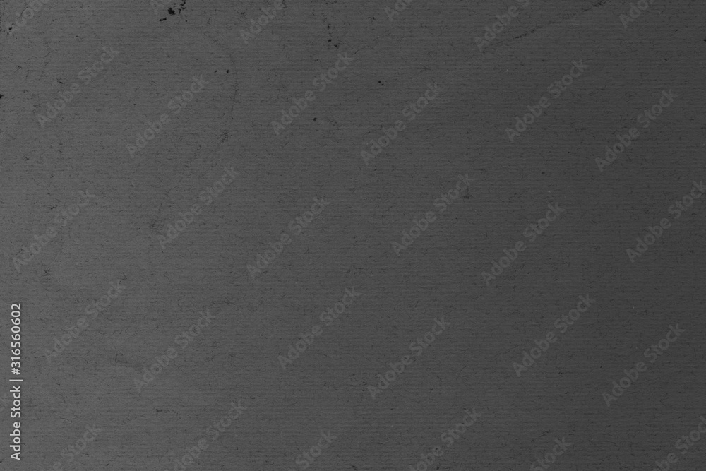 Cardboard black abstract texture close-up. Dark old paper background. Grunge concrete wall. Vintage blank wallpaper. Cardboard black abstract texture close-up. Dark old paper background. Grunge concrete wall. Vintage blank wallpaper.