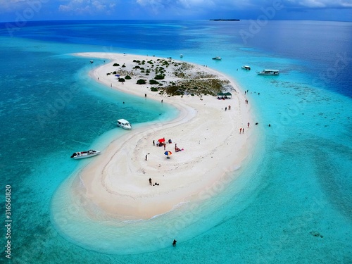 The aerial view of the stunning white sandbank with beautiful sandy beaches of Maldives