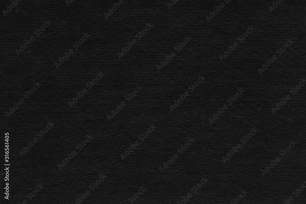 Cardboard black abstract texture close-up. Dark old paper background. Grunge concrete wall. Vintage blank wallpaper. Cardboard black abstract texture close-up. Dark old paper background. Grunge concrete wall. Vintage blank wallpaper.