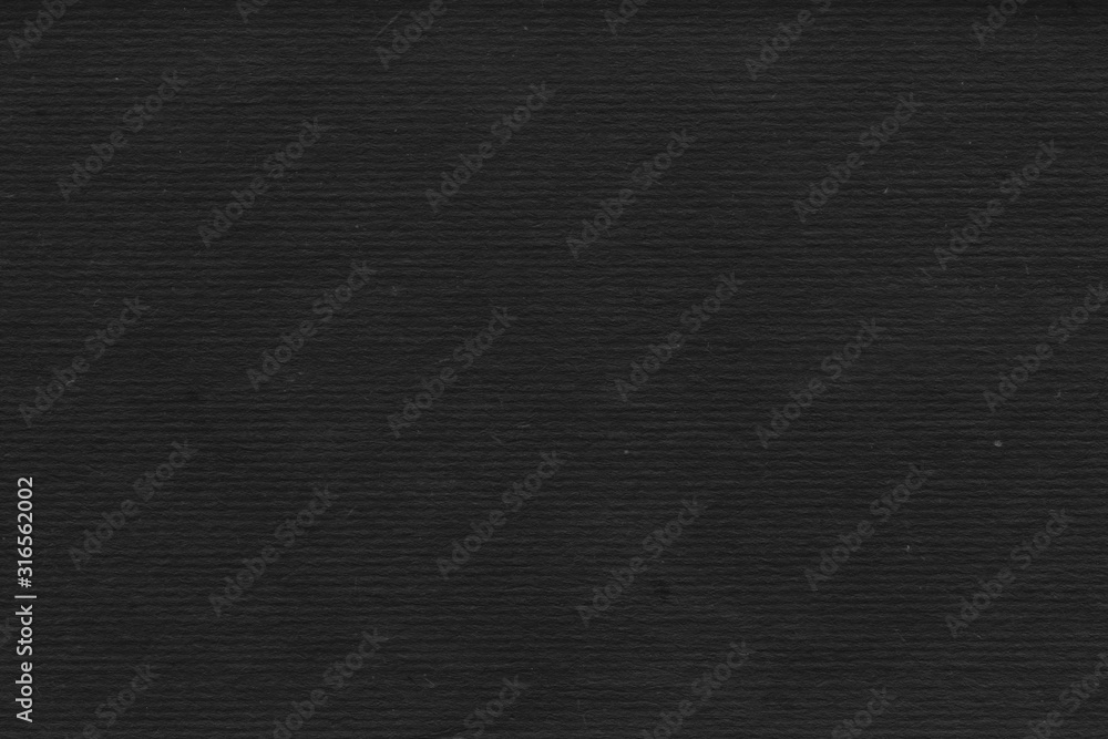 Cardboard black abstract texture close-up. Dark old paper background. Grunge concrete wall. Vintage blank wallpaper. Cardboard black abstract texture close-up. Dark old paper background. Grunge concrete wall. Vintage blank wallpaper.