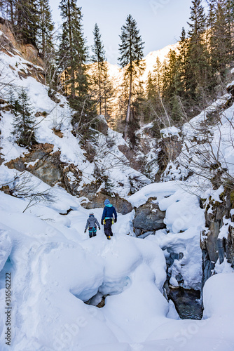 People winter hiking in the Taschachschlucht in Austria