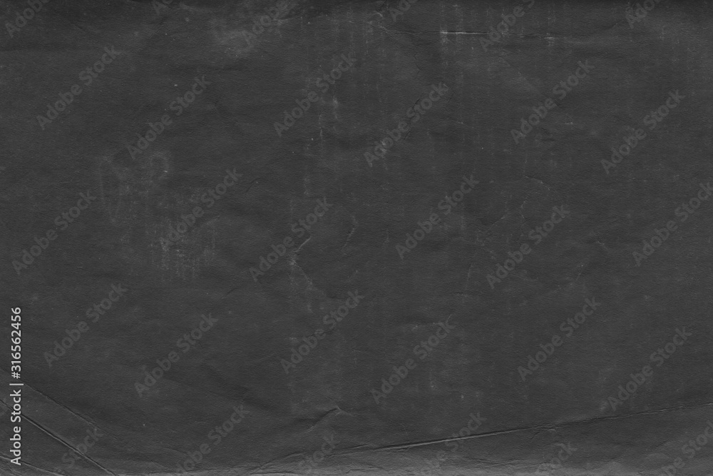Cardboard black abstract texture close-up. Dark old paper background. Grunge concrete wall. Vintage blank wallpaper. Cardboard black abstract texture close-up. Dark old paper background. Grunge concrete wall. Vintage blank wallpaper.