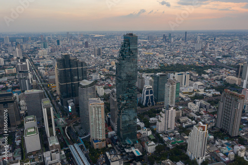 beautiful city view at twilight scene City scape of MahaNakhon building, skyscraper in the Silom/Sathon central business district of Bangkok as the tallest building in Thailand