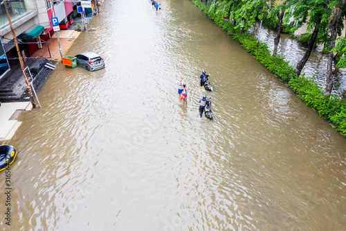 Aerial view of motorcycles crossing the flood