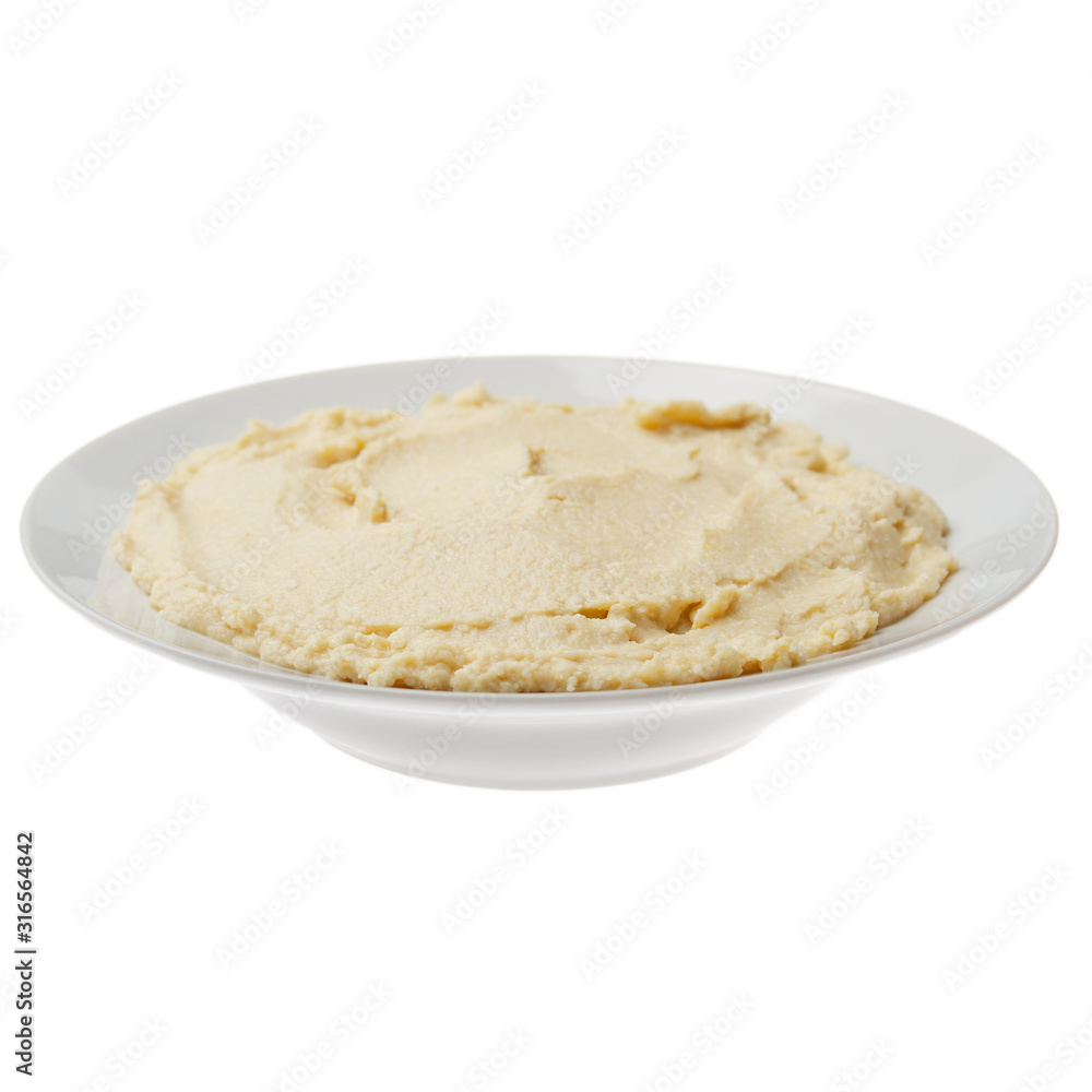 Plate with hummus - spread made from cooked, mashed chickpeas blended with tahini, lemon juice, and garlic isolated on white background. Clipping path added