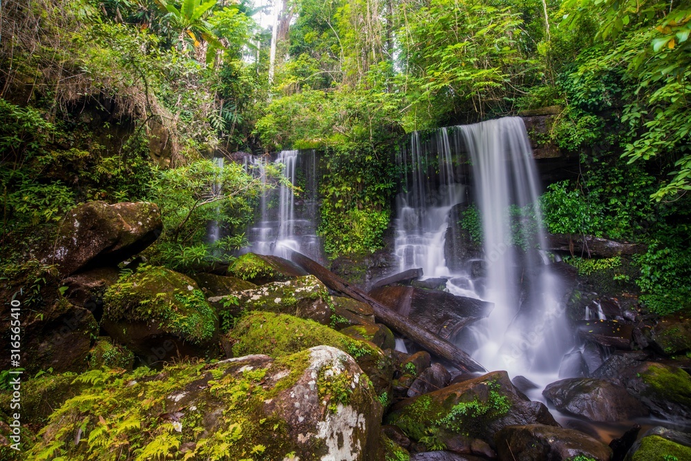 Obraz premium The beautiful waterfall in deep forest during rainy season at Phu Hin Rong Kla National Park, Thailand