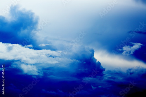 dramatic sky and clouds, deep blue, navy color, concept of background
