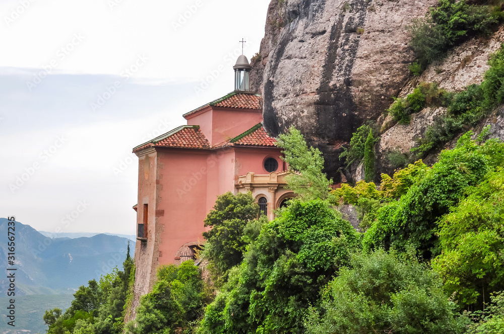 Small church in rock on Montserrat mountaun where Black Madonna was found, Barcelona, Spain