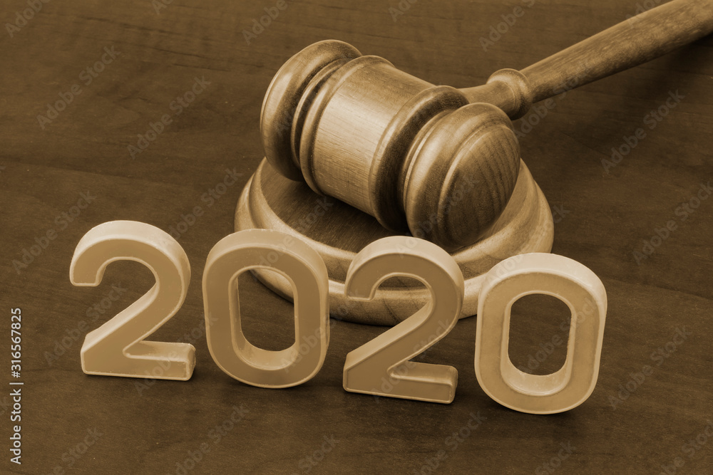 Wooden gavel and numbers 2020. New laws in year 2020 concept. Wooden gavel and numbers 2020. New laws in year 2020 concept.
