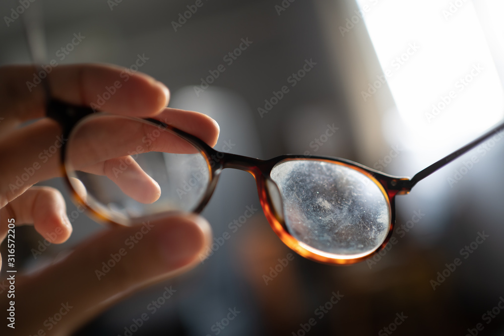 Eyeglasses with dirty marks on lens - obrazy, fototapety, plakaty 