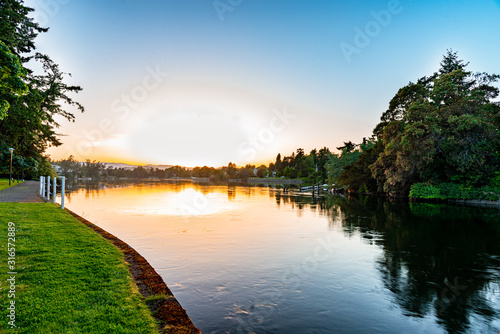 Gorge park in Esquimalt British Columbia during a great sunset over the river photo