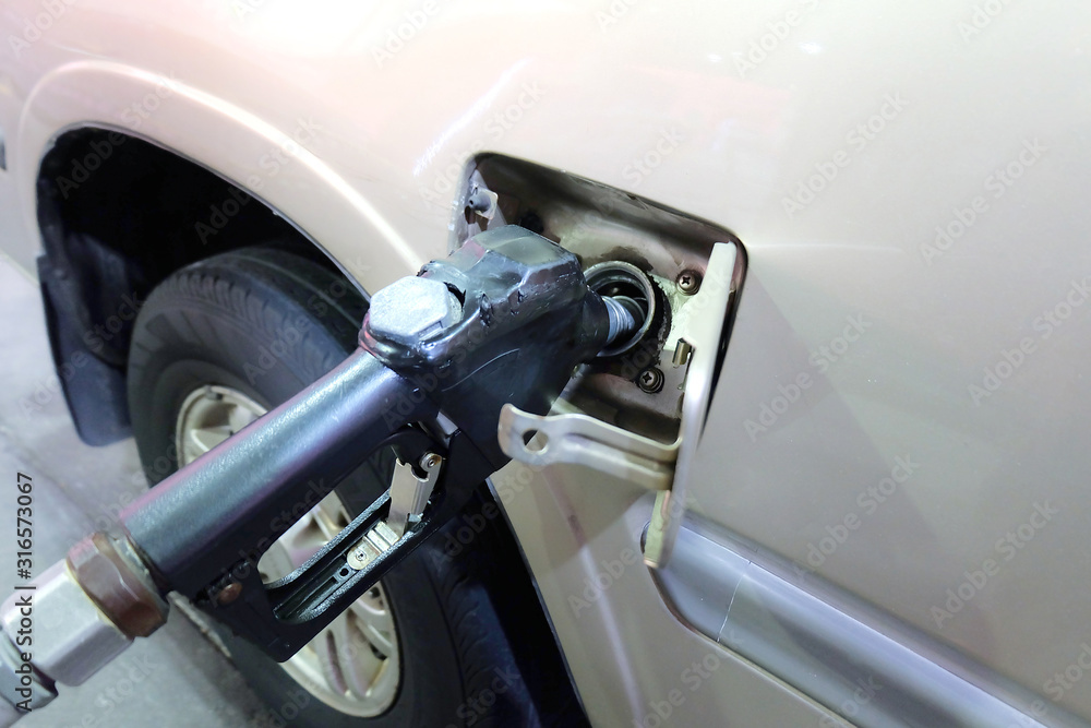 Close up Refueling Car filled with diesel at a gas station Close up Refueling Car filled with diesel at a gas station