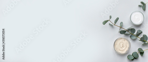 Eco friendly homemade cream for face and skin on gray