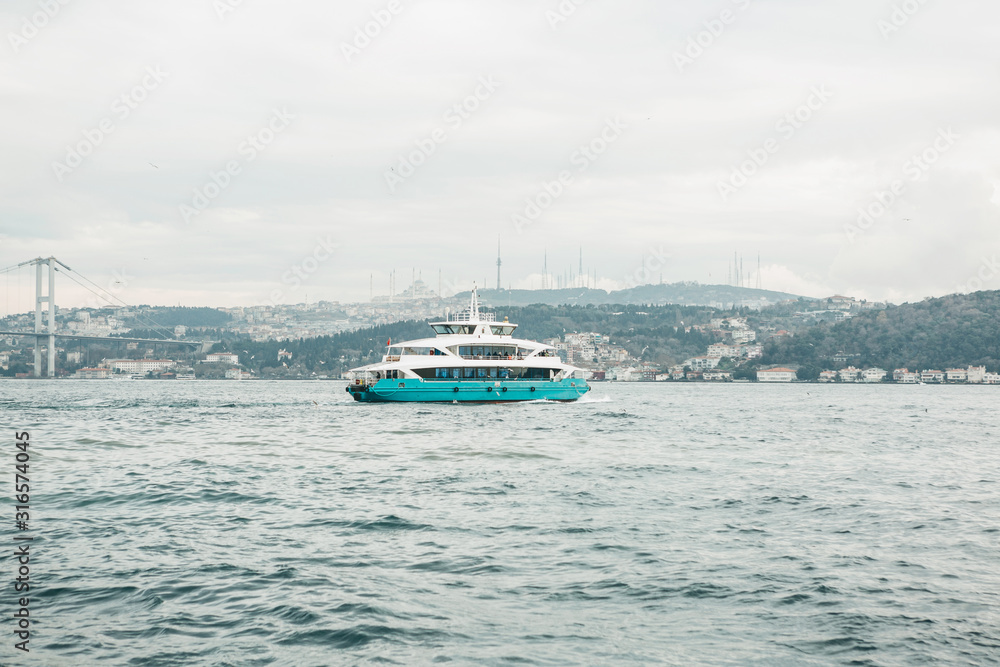 A ferry sailing along the Bosphorus in Istanbul. Traditional public water transport