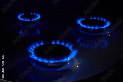 Gas. Burning blue flame kitchen stove
