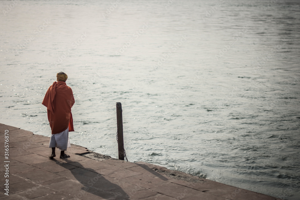 Man in Ganges river in Rishikesh, India