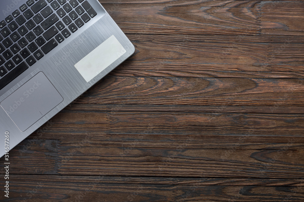Laptop on an office desk with copy space. Flat lay, top view. Laptop on an office desk with copy space. Flat lay, top view.
