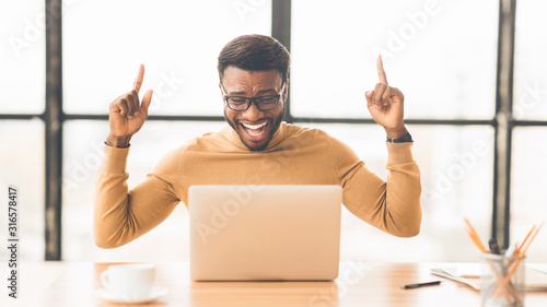 Ecstatic afro guy found new good idea photo