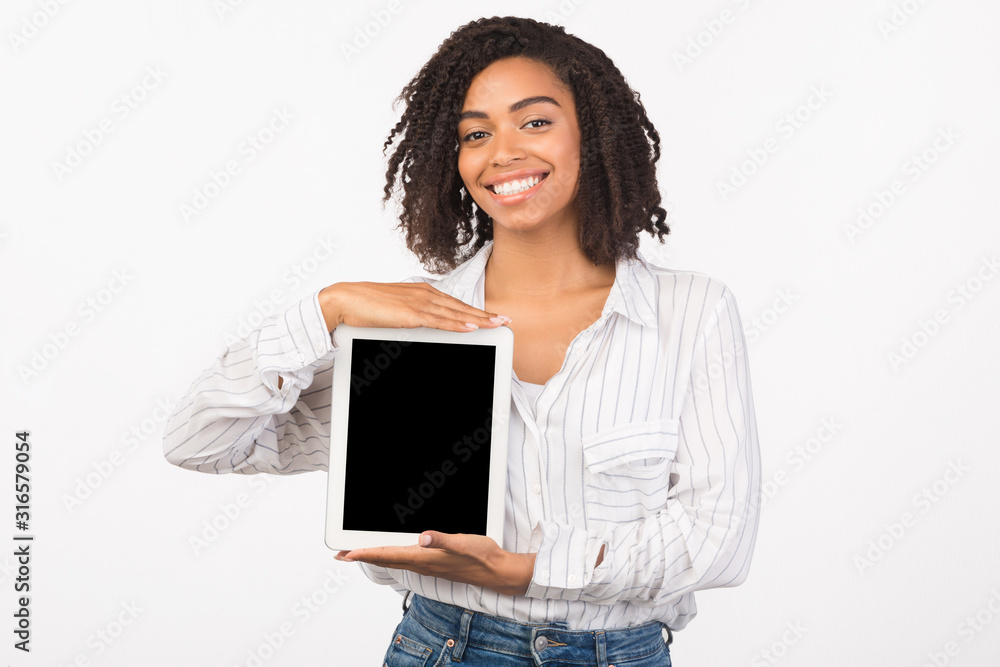 Smiling african american girl presenting new app Smiling african american girl presenting new app